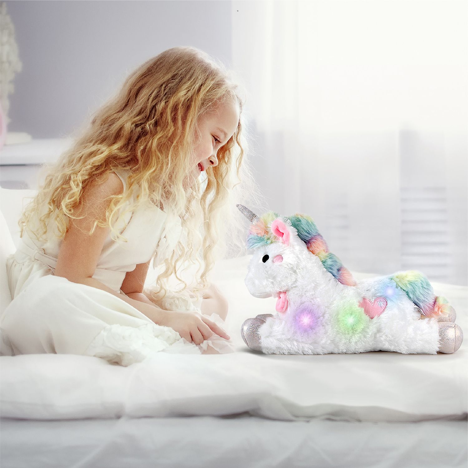 Unicorno di peluche con led e suoni 30 cm - FAO Schwarz