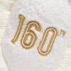Orsetto di peluche Anniversario con giacca dorata 33 cm - FAO Schwarz